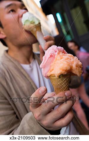 Man eating ice cream in Rome Italy. View Large Photo Image Stock Image - Man eating ice cream in Rome Italy.. Fotosearch