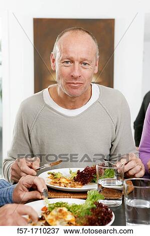 Man eating View Large Photo Image Stock Photo - Man eating. Fotosearch