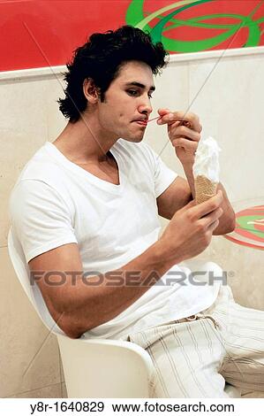 man eating View Large Photo Image Stock Photo - man eating. Fotosearch