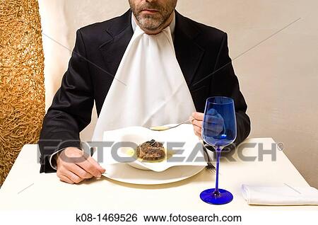 Stock Photograph - Man eating. Fotosearch