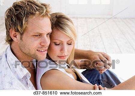 Man embracing a woman View Large Photo Image Stock Image - Man embracing a woman. Fotosearch