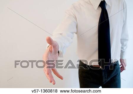Man extending his open hand, offering handshake View Large Photo Image Stock Photo - Man extending his open hand, offering handshake. Fotosearch