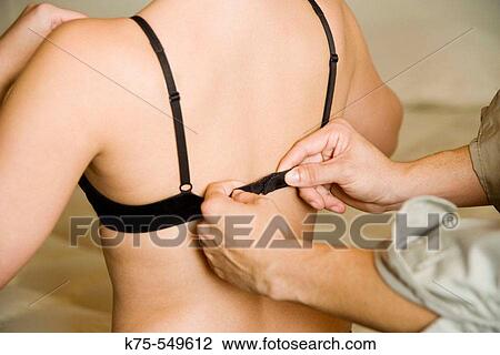 man fastening woman's bra View Large Photo Image Stock Image - man fastening woman's bra. Fotosearch