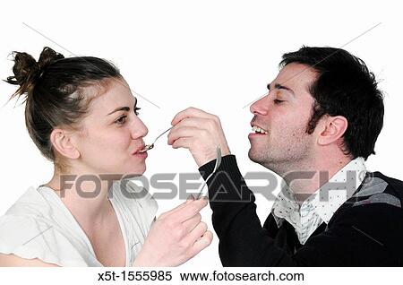 man feeds cream cake to a woman View Large Photo Image Stock Photography - man feeds cream cake to a woman. Fotosearch