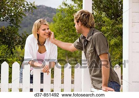 Man flirting with his neighbor View Large Photo Image Stock Image - Man flirting with his neighbor. Fotosearch