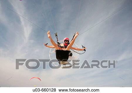 Man flying with a parachute. Beach. Engine. Valencia. Spain. View Large Photo Image Stock Photo - Man flying with a parachute. Beach. Engine. Valencia. Spain.. Fotosearch