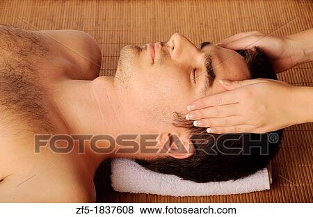 Man getting a face massage at spa View Large Photo Image Stock Photo - Man getting a face massage at spa. Fotosearch