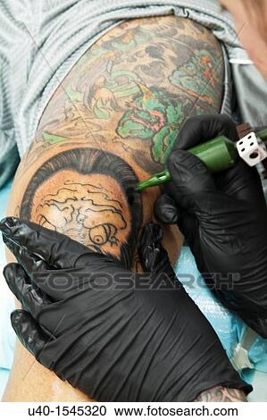 Man getting tattoo on knee View Large Photo Image Stock Image - Man getting tattoo on knee. Fotosearch