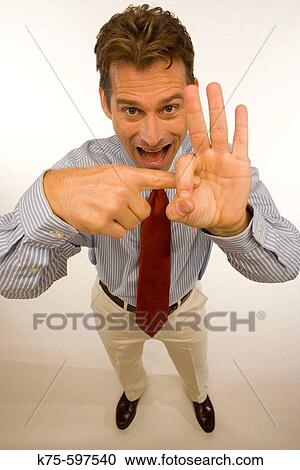Stock Image - Man giving hand gesture. Fotosearch