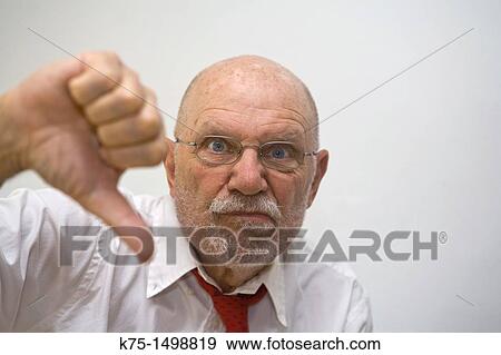 Man giving the sign of thumbs down View Large Photo Image Stock Photo - Man giving the sign of thumbs down. Fotosearch
