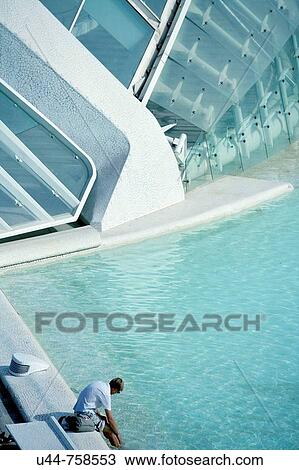 Stock Image - Man having a rest in the City of Arts and Sciences, Valencia. Comunidad Valenciana, Spain. Fotosearch