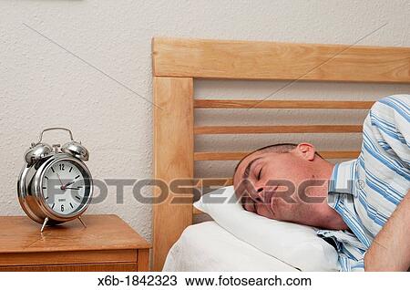 Man having nap siesta during the afternoon View Large Photo Image Stock Image - Man having nap siesta during the afternoon. Fotosearch