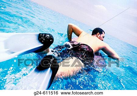 Man heading out to sea with boogeyboard, Caribbean View Large Photo Image Stock Photograph - Man heading out to sea with boogeyboard, Caribbean. Fotosearch