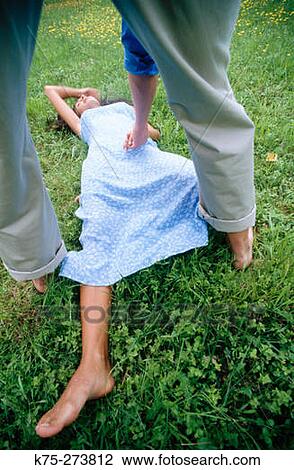 man helping woman on lawn View Large Photo Image Stock Image - man helping woman on lawn. Fotosearch