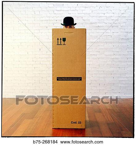 Man hiding inside a cardboard box View Large Photo Image Picture - Man hiding inside a cardboard box. Fotosearch