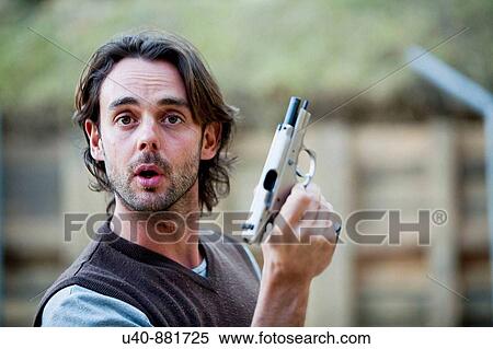 Man holding 9mm gun View Large Photo Image Stock Photography - Man holding 9mm gun. Fotosearch