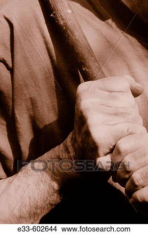 Man holding a baseball bat View Large Photo Image Picture - Man holding a baseball bat. Fotosearch