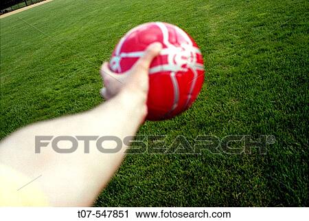 Man holding a soccer ball View Large Photo Image Stock Image - Man holding a soccer ball. Fotosearch