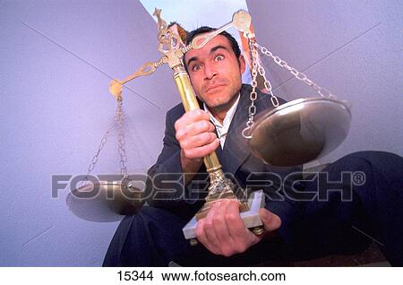 Man holding balance View Large Photo Image Picture - Man holding balance. Fotosearch