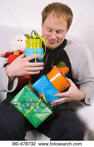Man holding parcels View Large Photo Image Stock Image - Man holding parcels. Fotosearch