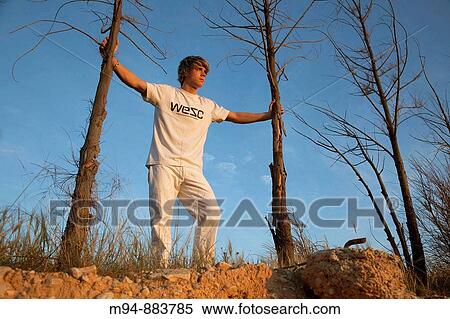 Man holding two trees View Large Photo Image Stock Photography - Man holding two trees. Fotosearch