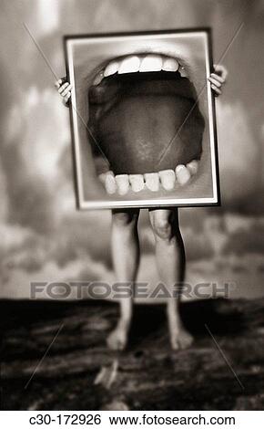 Man holds sign of open mouth View Large Photo Image Stock Photograph - Man holds sign of open mouth. Fotosearch