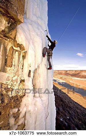 Man ice climbing a mixed variation to The Double Pillar route which is rated WI5, M5 at The Mother Lode Area in the Snake River Canyon near the city of Twin Falls in southern Idaho USA View Large Photo Image Stock Photography - Man ice climbing a mixed variation to The Double Pillar route which is rated WI5, M5 at The Mother Lode Area in the Snake River Canyon near the city of Twin Falls in southern Idaho USA. Fotosearch