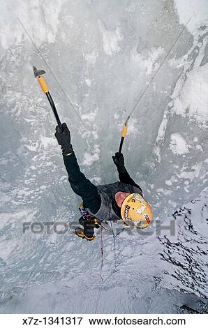 Man ice climbing a route called Genesis which is rated WI, 5 and located in Hyalite Canyon near the city of Bozeman in western Montana View Large Photo Image Stock Photo - Man ice climbing a route called Genesis which is rated WI, 5 and located in Hyalite Canyon near the city of Bozeman in western Montana. Fotosearch