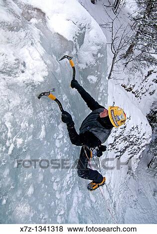 Man ice climbing a route called Genesis which is rated WI, 5 and located in Hyalite Canyon near the city of Bozeman in western Montana View Large Photo Image Stock Photo - Man ice climbing a route called Genesis which is rated WI, 5 and located in Hyalite Canyon near the city of Bozeman in western Montana. Fotosearch