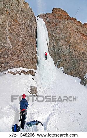 Man ice climbing a route which is rated WI4 near Silver Creek high in the Boulder Mountains in central Idaho View Large Photo Image Stock Photograph - Man ice climbing a route which is rated WI4 near Silver Creek high in the Boulder Mountains in central Idaho. Fotosearch