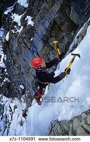 Man, ice climbing in Trail Creek Canyon near the city of Sun Valley in central Idaho View Large Photo Image Stock Image - Man, ice climbing in Trail Creek Canyon near the city of Sun Valley in central Idaho. Fotosearch