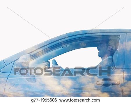 Stock Photograph - Man in a car with sky. Fotosearch