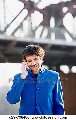 Man in a suit with mobile phone View Large Photo Image Stock Photograph - Man in a suit with mobile phone. Fotosearch