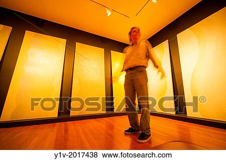 Stock Photo - Man in an empty room in an office building.. Fotosearch