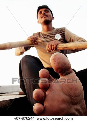 Man in boat on Ganges river, Varanasi, Uttar Pradesh, India View Large Photo Image Picture - Man in boat on Ganges river, Varanasi, Uttar Pradesh, India. Fotosearch