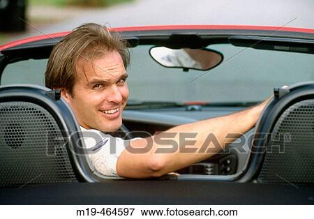 man in convertible car View Large Photo Image Stock Photo - man in convertible car. Fotosearch