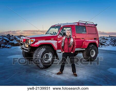 Man in front of a modified Jeep, Iceland. View Large Photo Image Stock Image - Man in front of a modified Jeep, Iceland.. Fotosearch