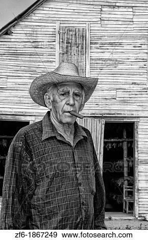 Man in front of tobacco farm house shed house in Pinar del Rio Province in rural Cuba Caribbean View Large Photo Image Stock Photo - Man in front of tobacco farm house shed house in Pinar del Rio Province in rural Cuba Caribbean. Fotosearch