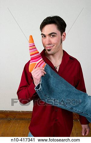 Man, in his mid-thirties, holding another person's leg. View Large Photo Image Stock Image - Man, in his mid-thirties, holding another person's leg.. Fotosearch