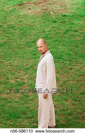 Man in his pijamas on the grass. View Large Photo Image Stock Image - Man in his pijamas on the grass.. Fotosearch