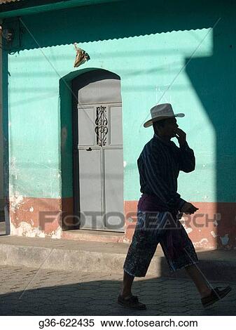 Man in local traditional dress (shorts) walks in Santiago Atitlan, Guatemala View Large Photo Image Stock Photography - Man in local traditional dress (shorts) walks in Santiago Atitlan, Guatemala. Fotosearch