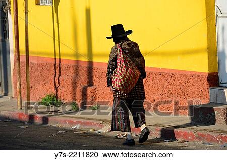 Stock Image - Man in local traditional dress walks in Solola, Guatemala, Central America.. Fotosearch