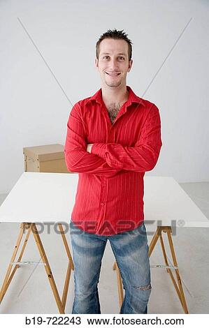 Stock Image - Man in new home. Fotosearch