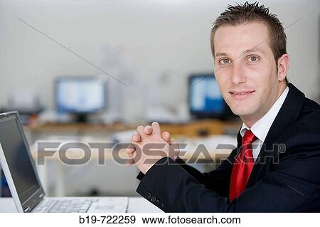 Stock Photo - Man in office. Fotosearch