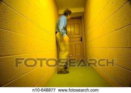 Man in the hallway of an office building View Large Photo Image Stock Photo - Man in the hallway of an office building. Fotosearch