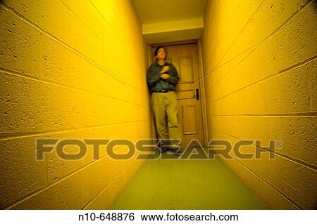 Man in the hallway of an office building View Large Photo Image Stock Photograph - Man in the hallway of an office building. Fotosearch