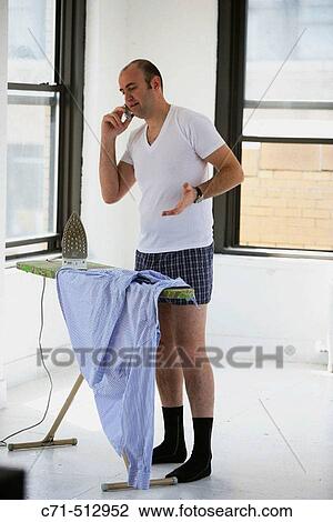 Man in underwear ironing his clothes. View Large Photo Image Stock Image - Man in underwear ironing his clothes.. Fotosearch