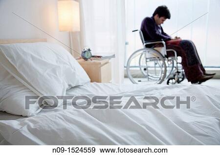 Man in wheelchair View Large Photo Image Stock Photo - Man in wheelchair. Fotosearch