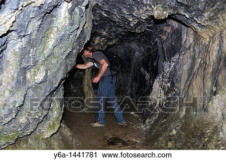 Man inside cave, Triglav National Park, Julian Alps, Slovenia, Septembar 2010 View Large Photo Image Stock Image - Man inside cave, Triglav National Park, Julian Alps, Slovenia, Septembar 2010. Fotosearch