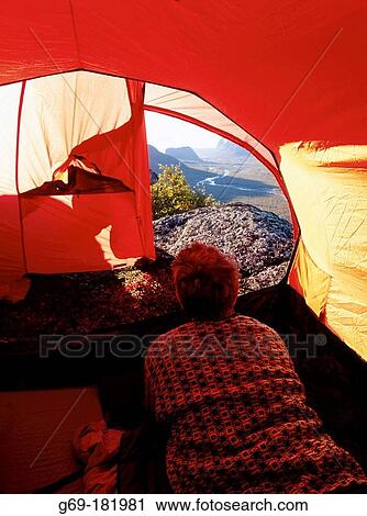 Stock Image - Man inside tent. Sarek National Park. Sweden. Fotosearch